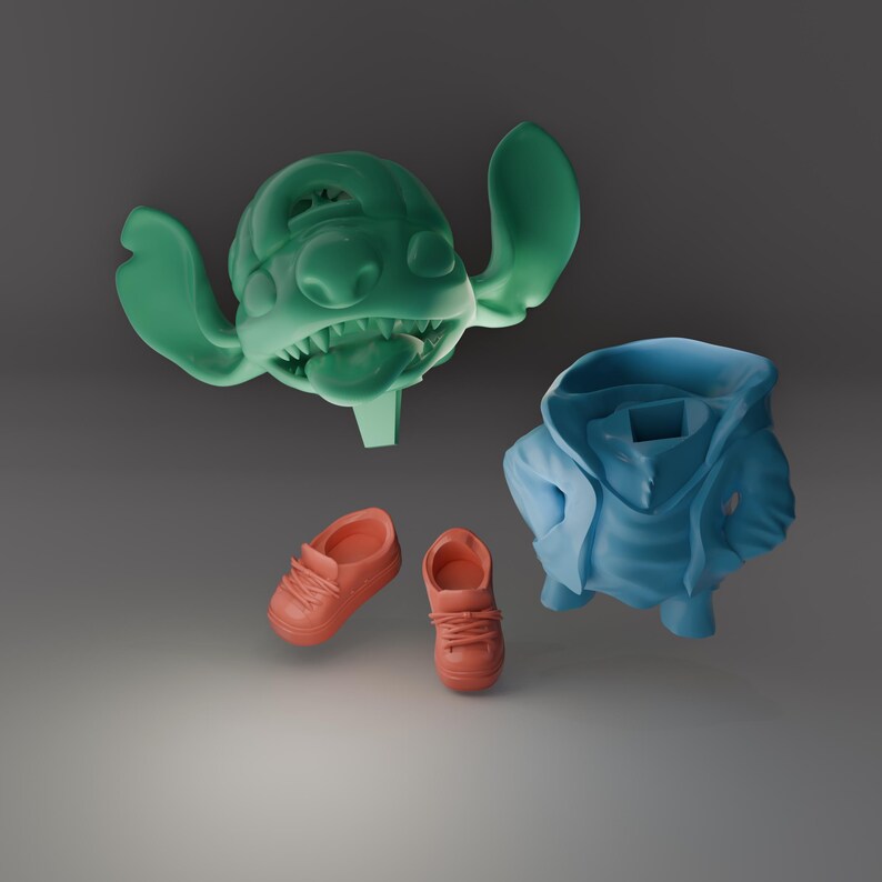 May include: A collection of 3D-printed items featuring a green character head with large ears and a wide grin, a blue hoodie, and two pairs of orange sneakers. The items appear to be floating against a gray background.