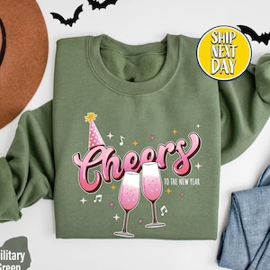 Cheers To The New Year Sweatshirt, Hello 2025 Shirt, Happy New Year Gift, Champagne Lover Hoodie, Cute Wine Sweater, Gift For Friends -CC202