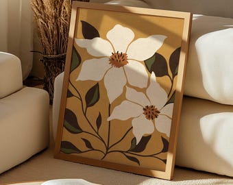 May include: A rectangular framed wall art piece featuring a mustard yellow background with two large white flowers. The flowers have brown centers and are surrounded by dark green leaves and thin black stems. The frame is a light-colored wood material.
