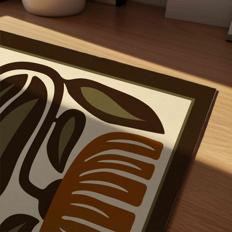 May include: A rectangular decorative mat with a retro design. The mat features a cream-colored background with brown, olive green, and orange abstract shapes and a dark brown border. The design includes leaf and curved shapes.