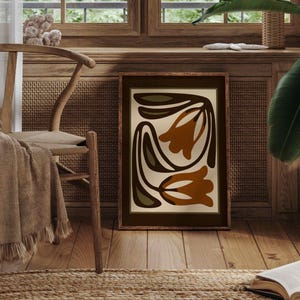 May include: A set of three ceramic mugs with a speckled, matte finish. The mugs are in shades of cream, light gray, and dark gray. Each mug has a simple, minimalist design and a rounded handle.