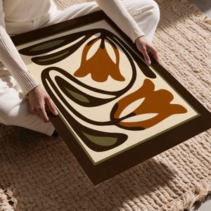 May include: A white ceramic mug with a black handle and the text "But First, Coffee" in a black, bold font. The mug is on a white surface. The mug is approximately 4 inches tall.