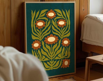 May include: A framed floral art print featuring a teal background with orange and white flowers and green leaves. The artwork is in a wooden frame and leans against a wooden wall. The style is retro and botanical.
