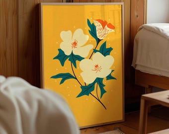 May include: A framed floral art print featuring white flowers with orange and yellow accents against a yellow background. The artwork includes dark teal leaves and a light wooden frame. The print is a botanical illustration.