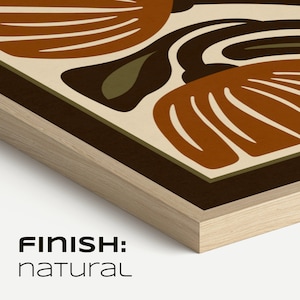 May include: A framed art print with a retro floral design in brown, olive green, and cream. The artwork has a dark brown border and a natural wood frame. The text "FINISH: NATURAL" is displayed at the bottom of the frame.