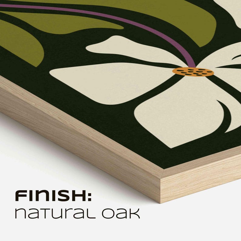May include: A framed art print with a white floral design, yellow center, and green leaves on a dark backdrop. The frame is natural oak, with the text "FINISH: NATURAL OAK" at the bottom.