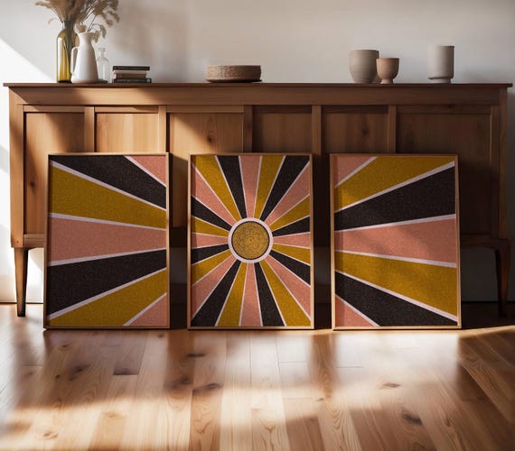 Sunburst wall art in funky 70s aesthetic triptych featuring a bold geometric design, bringing retro and mid-century vibes to any space.
