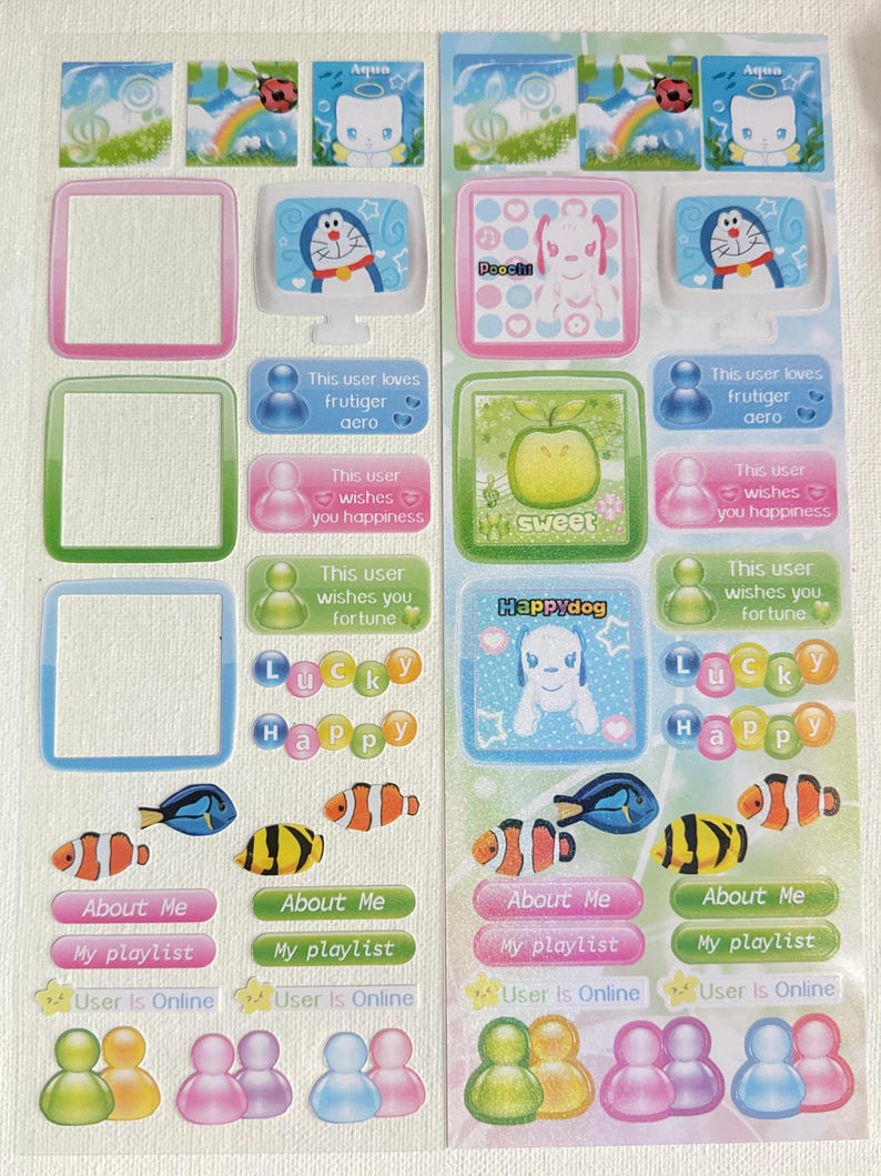 May include: Two sheets of colorful stickers with various designs. The stickers feature cartoon characters, fish, and text like "About Me" and "My playlist." The color palette includes pink, blue, green, and yellow.