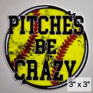 May include: A yellow softball with red stitching and a distressed look. The text "Pitches Be Crazy" is printed in black on the softball. The softball is 3 inches by 3 inches.