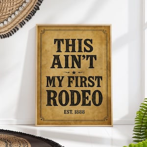 Funny Western “This Ain’t My First Rodeo” Sign Print – Rustic Farmhouse Cowboy Quote Wall Decor, Country Bar & Bathroom Poster