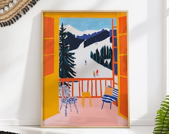May include: A framed art print depicts a balcony scene overlooking a snowy ski slope. The artwork features a vibrant color palette with orange window frames, a yellow wall, and a pink floor. Two chairs and a small table are on the balcony.