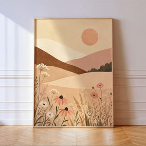 Peut inclure: Une impression d'art mural rectangulaire dans un cadre en bois clair représentant une illustration de paysage avec des collines vallonnées dans des tons beige, marron et terre cuite sous un soleil circulaire, avec des fleurs sauvages.