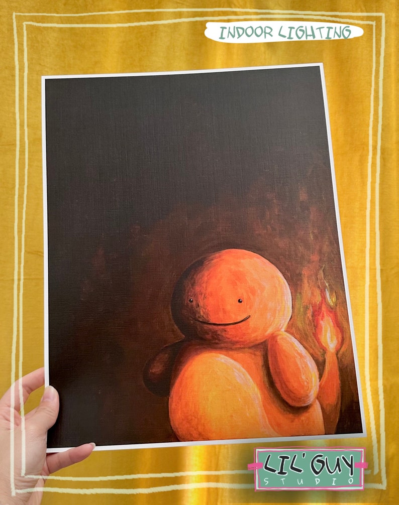 May include: A painting of a cartoon character with orange skin and a flame on its tail. The character is smiling and has a dark background. The painting is titled "Indoor Lighting" and signed "Lil' Guy Studio".