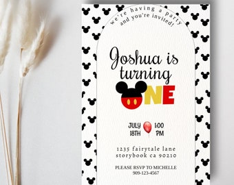 May include: A white and black Mickey Mouse themed birthday party invitation for a boy named Joshua turning one year old. The invitation features a red and yellow Mickey Mouse head with the number one in red and yellow. The invitation includes the date, time, and address of the party. The text on the invitation reads "we're having a party and you're invited! Joshua is turning one. July 18th 1:00 PM. 1235 fairytale lane storybook ca 90210. Please RSVP to Michelle 909-123-4567."