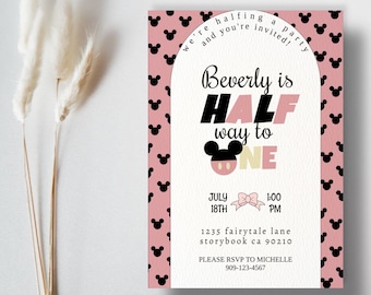 May include: A pink and black invitation with a Mickey Mouse theme. It says "Beverly is Half way to One" with a Mickey Mouse head and a bow. The date and time are 18th July at 1:00 PM. The address is 1235 Fairytale Lane, Storybook CA 90210. It says "Please RSVP to Michelle 909-123-4567".
