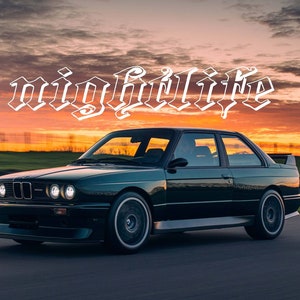 May include: A dark green BMW M3 sports car driving on a race track at sunset. The car has a black spoiler and white headlights. The text "nightlife" is written in white above the car.
