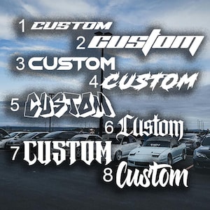 May include: A collection of eight white "Custom" text designs in various fonts, set against a cloudy sky background. The designs are numbered and appear to be car decals or stickers, with a car parked in the background.