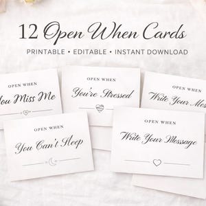 May include: A collection of 12 "Open When" cards, printable and editable. Each card features a unique prompt, such as "You Miss Me" and "You're Stressed", with elegant script. The cards are arranged on a white surface with floral accents.