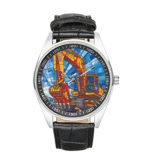 May include: A silver wristwatch with a black leather band. The watch face features a colorful stained glass design of an excavator.
