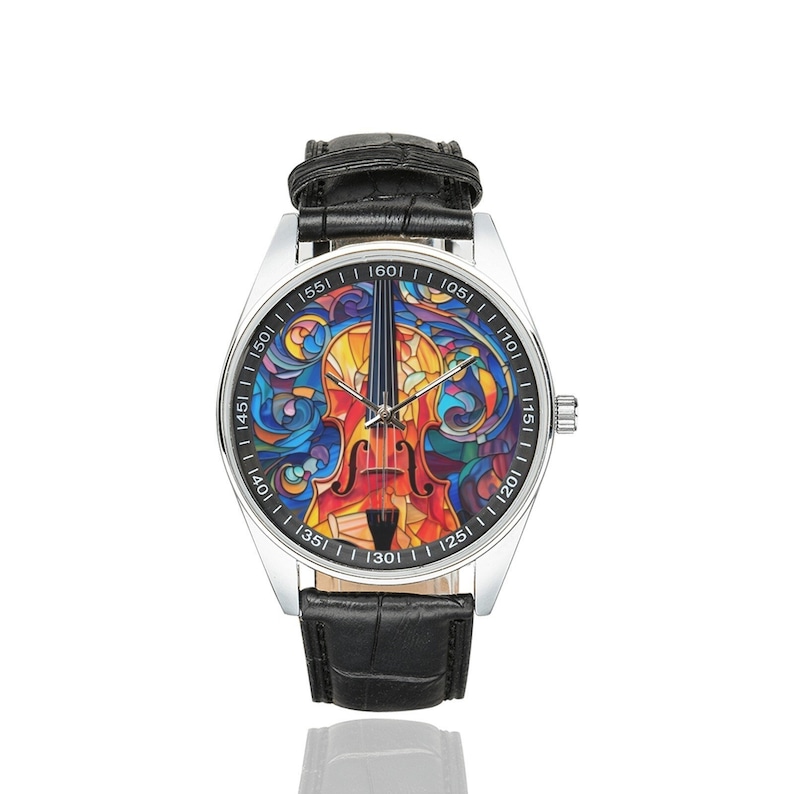 May include: A silver wristwatch with a black leather band features a colorful stained glass design of a violin on the face. The watch face has numbers from 10 to 160.
