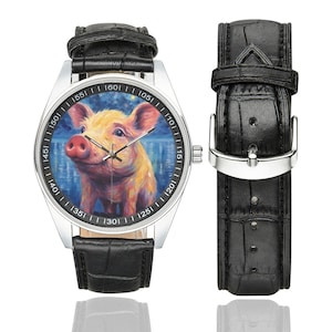 May include: A silver wristwatch with a black leather band features a colorful painting of a pig on the face. The watch face has white numbers and markings.