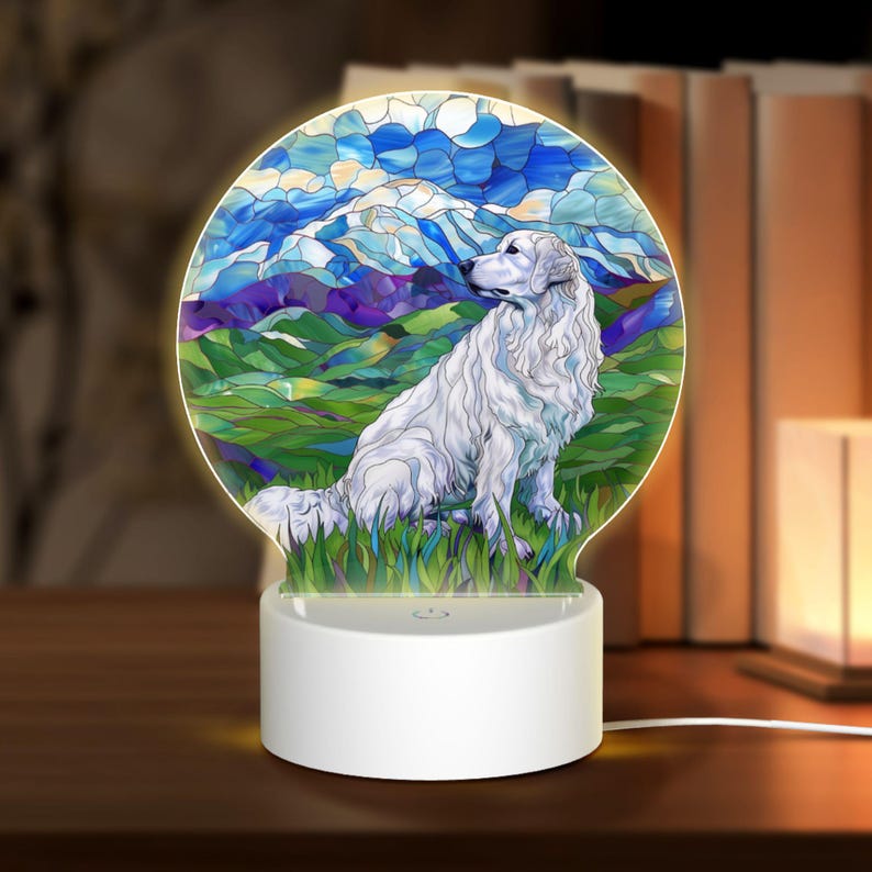 May include: A white 3D printed night light with a stained glass design of a white dog sitting in a field with mountains in the background.