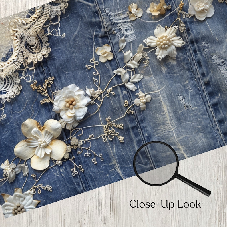 May include: Close-up of a denim fabric adorned with delicate, handcrafted floral embellishments. The flowers are primarily white and cream, with intricate details and pearl accents. The text "Close-up Look" is visible.