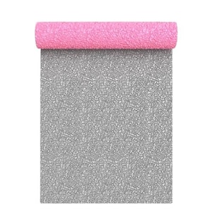 May include: A rolled-up pink yoga mat with a textured surface. The unrolled portion of the mat is gray with a cracked pattern. The mat is designed for exercise and fitness activities.