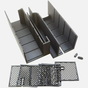 May include: A black plastic miter box with multiple compartments and angled sides, designed for precise cutting. Includes several black mesh screens and small hardware pieces. Ideal for woodworking and DIY projects.