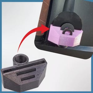 May include: A black 3D printed object with a rectangular base and a raised section with three slots. The object is designed to hold a sanding disc.