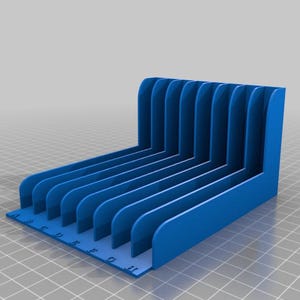 May include: A blue, 3D-printed desk organizer with multiple vertical slots for holding papers or files. The organizer has a right-angle design with a base labeled with letters. The overall design is modern and functional.