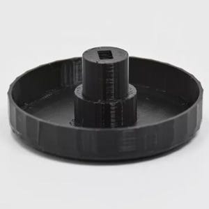 May include: A black plastic knob with a raised center and a textured outer edge.