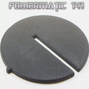 May include: A black plastic part with a slot cut out of it. The part is labeled "POWERMATIC 141".