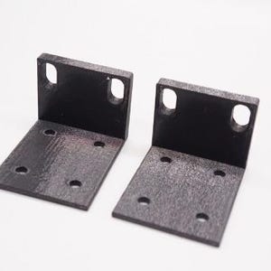 May include: Two black metal brackets with multiple holes for mounting. The brackets are L-shaped and have a textured surface.