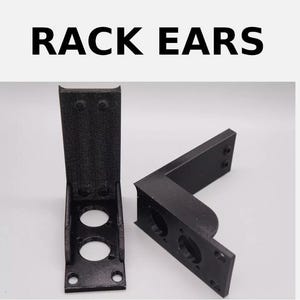 May include: Two black plastic rack ears with two holes each. The ears are designed to be mounted on the back of a device to allow it to be installed in a standard 19-inch rack.
