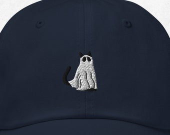 May include: A navy blue baseball cap with an embroidered white ghost cat design.