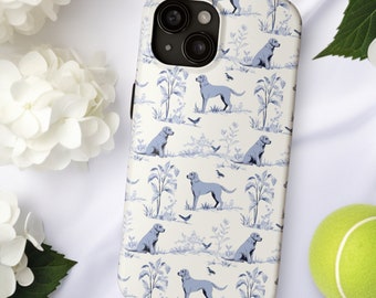 May include: A white phone case with a blue and white pattern of dogs and flowers. The case has a camera lens cutout.