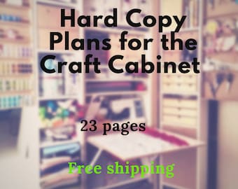 May include: A blurred image of a craft room with shelves full of supplies. The text "Hard Copy Plans for the Craft Cabinet" is in large, bold letters at the top of the image. The text "23 pages" is below the title, and the text "Free shipping" is at the bottom of the image.