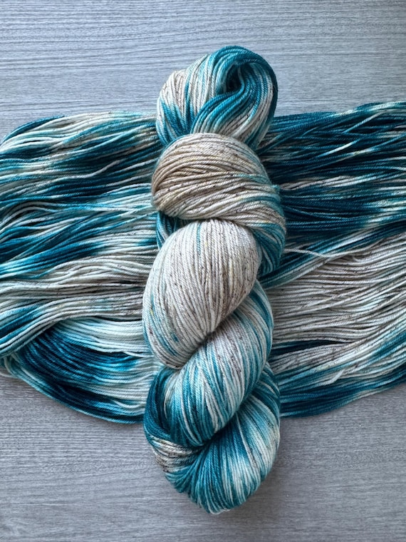 Variegated hand dyed sock yarn teal blue beige fingering weight yarn super wash merino yarn indie dyed speckled yarn for knitting crochet