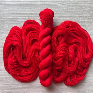Mini skein red yarn fingering weight yarn Kim’s Crayon Red solid true red colour yarn heel toe contrast boarder yarn for knitting crochet