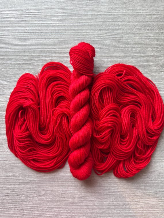 Mini skein red yarn fingering weight yarn Kim’s Crayon Red solid true red colour yarn heel toe contrast boarder yarn for knitting crochet