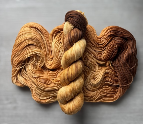 Assigned pooling hand dyed sock yarn gold and brown fingering weight yarn lions mane event super wash merino wool yarn indie dyed yarn