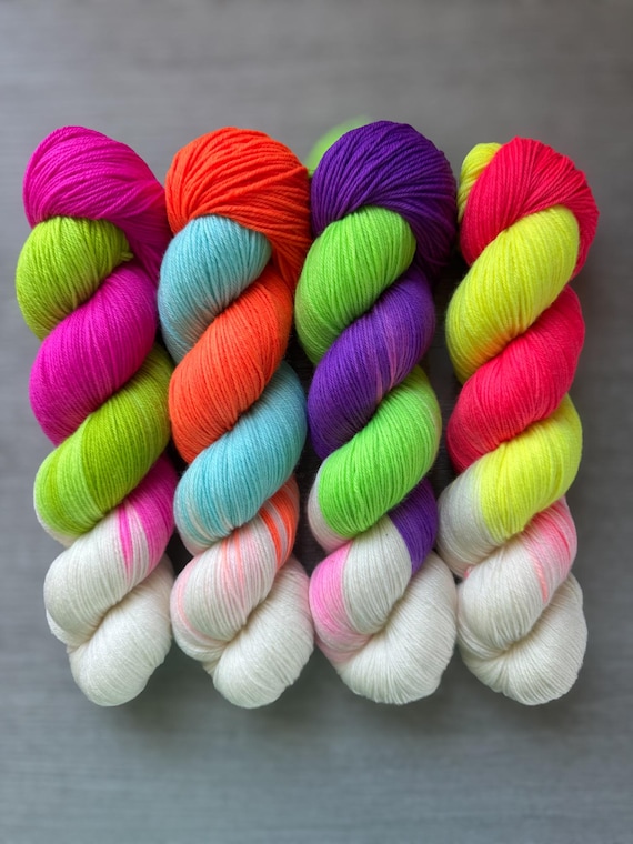 Neon Black Light Reactive Glitched Out funky pooling fingering weight yarn super wash merino wool sock yarn