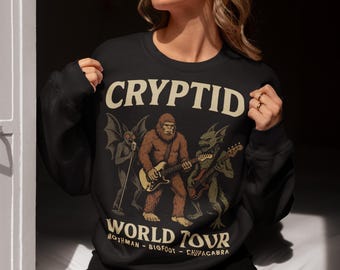 Cryptid World Tour Sweatshirt– Mothman Bigfoot Chupacabra Rock Band Top, Funny Cryptid Shirt, Paranormal Graphic, Sasquatch Gift"