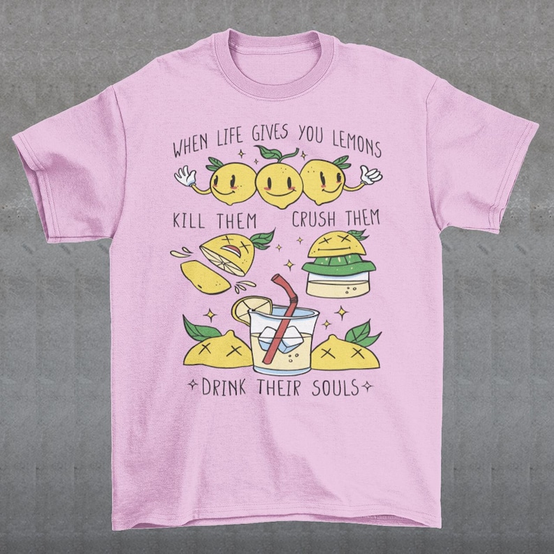 Introducing our adorable and quirky Lemonade-themed t-shirt that is sure to turn heads and bring a smile to your face! This shirt features a delightful design showcasing cute lemons being transformed into delicious lemonade, accompanied by the bold, tongue-in-cheek text: "WHEN LIFE GIVES YOU LEMONS, KILL THEM, CRUSH THEM AND DRINK THEIR SOULS."