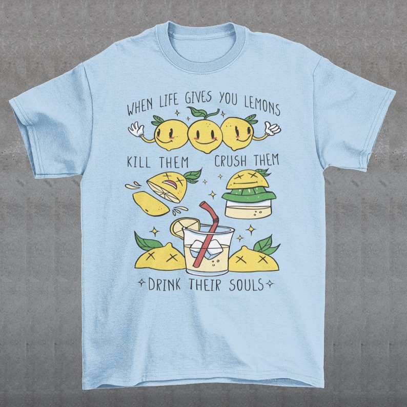 Introducing our adorable and quirky Lemonade-themed t-shirt that is sure to turn heads and bring a smile to your face! This shirt features a delightful design showcasing cute lemons being transformed into delicious lemonade, accompanied by the bold, tongue-in-cheek text: "WHEN LIFE GIVES YOU LEMONS, KILL THEM, CRUSH THEM AND DRINK THEIR SOULS."