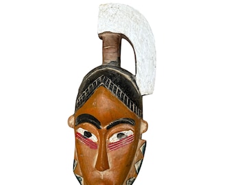 アフリカのバウレマスク部族の彫刻された木製の顔の装飾西アフリカの壁