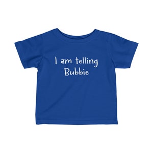 May include: A royal blue toddler t-shirt with white text that reads "I am telling Bubbie".