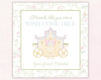 May include: A square card with a watercolor illustration of a fairytale carriage in pastel colors. The card has the text "Friends like you are a WISH COME TRUE" and "Your friend, Caroline" on a floral background.