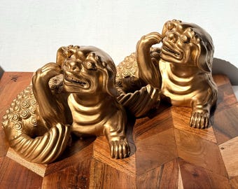 Vintage Heavy Solid Resin Gold Foo Dogs Pair Reclining Guardian Lions -2.75lb each -5.5” x 4” tall- rare playful pose